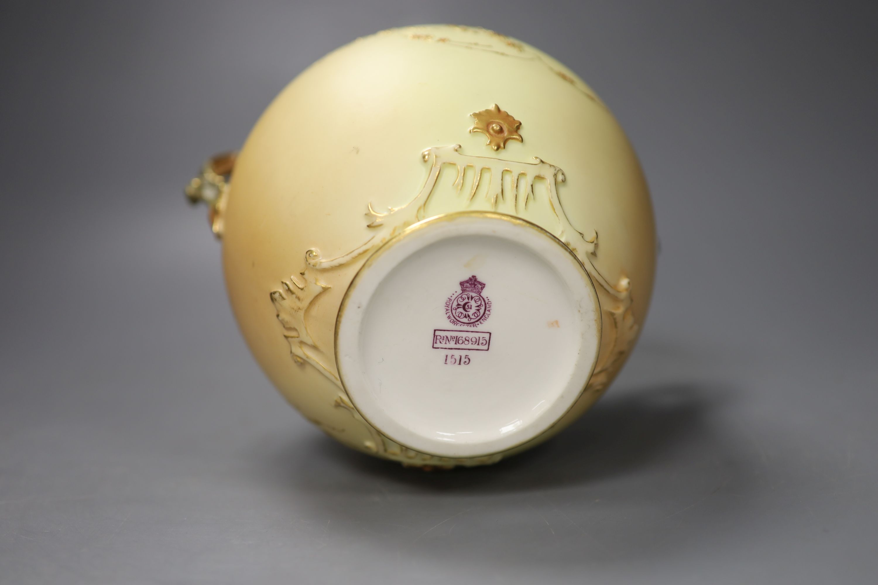 A Royal Worcester two handled ovoid vase moulded and gilded with flowers on a blush ivory ground, shape 1515 date code for 1896, 20cm h